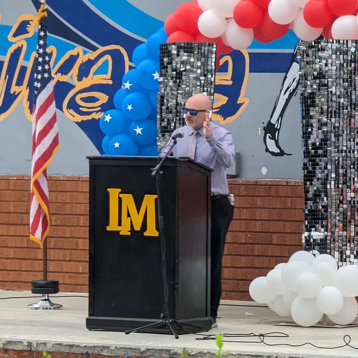 Principal Ben Webster speaks to the La Mirada High School staff and students during the September 11 Remembrance assembly.